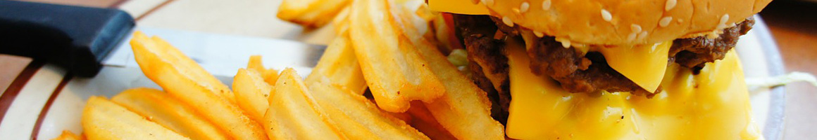 Eating Burger Diner at Southwell's Hamburger Grill restaurant in Houston, TX.
